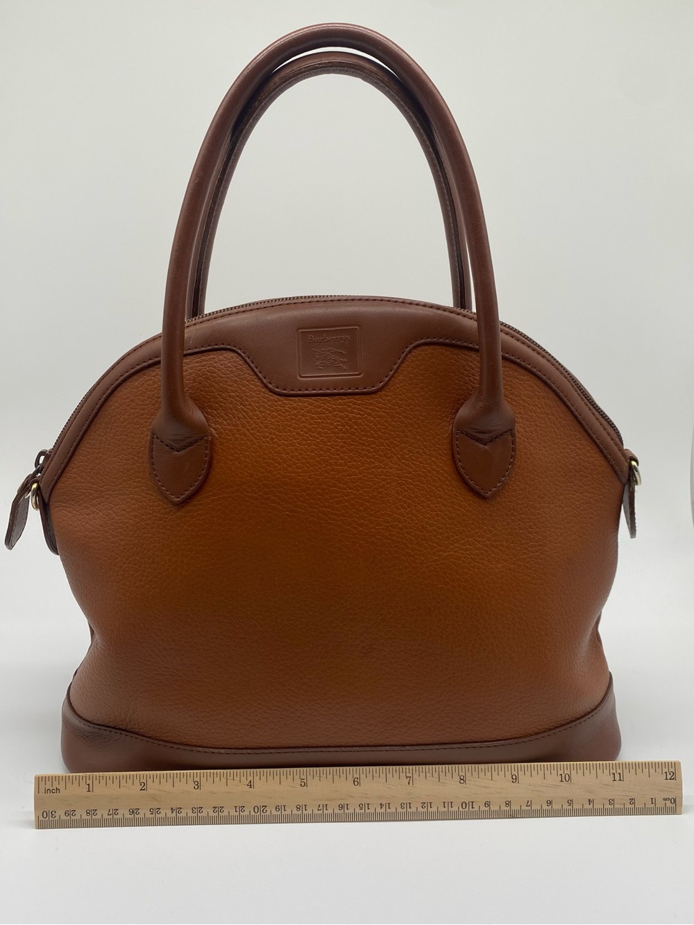 Burberry’s Brown Leather Dome Satchel Handbag